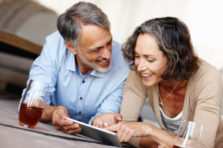 Middle-aged husband and wife discussing investment opportunities