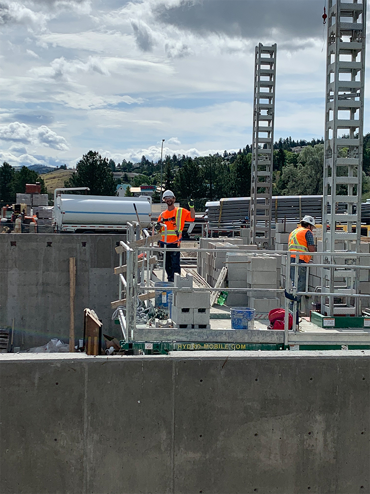 Kamloops property – construction workers doing masonry work