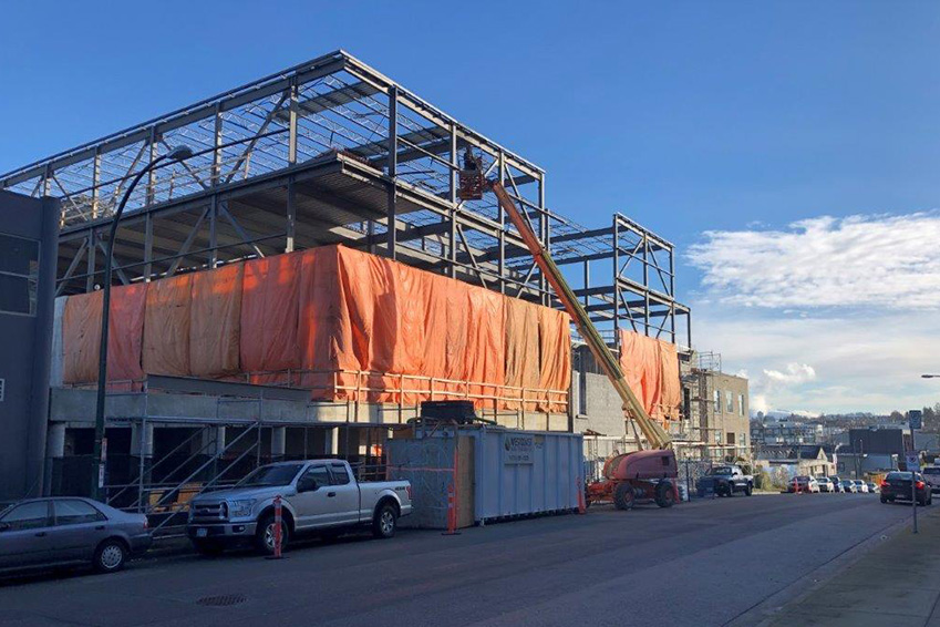 Tarps and temporary heating installed on the second floor of the NationWide Pender facility