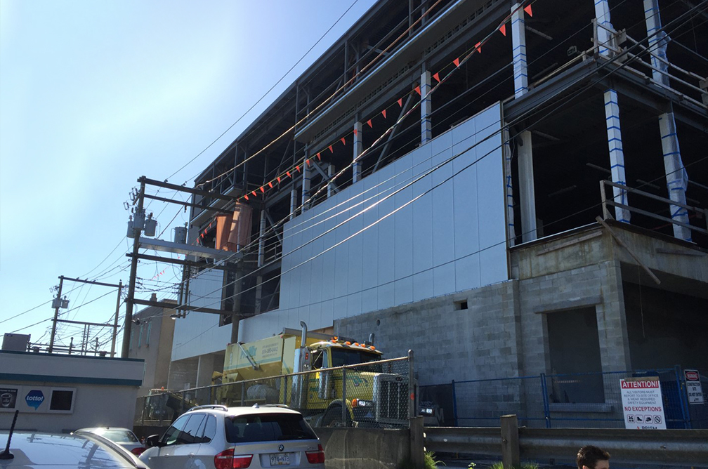 Pender property – metal cladding in progress for the second floor on the north wall