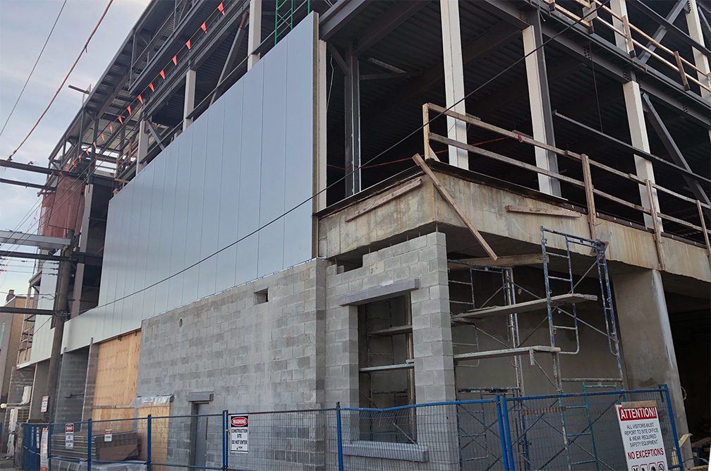 Pender property – metal cladding in progress on the north wall