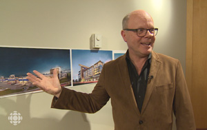 Stephen Creighton of Dymon Storage shows off drawings to CBC news of new facilities the company has under construction in Toronto